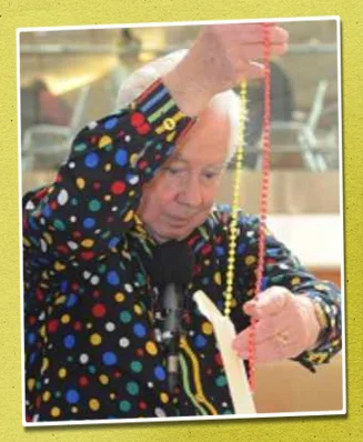 Royston performing a magic trick in a shopping centre.